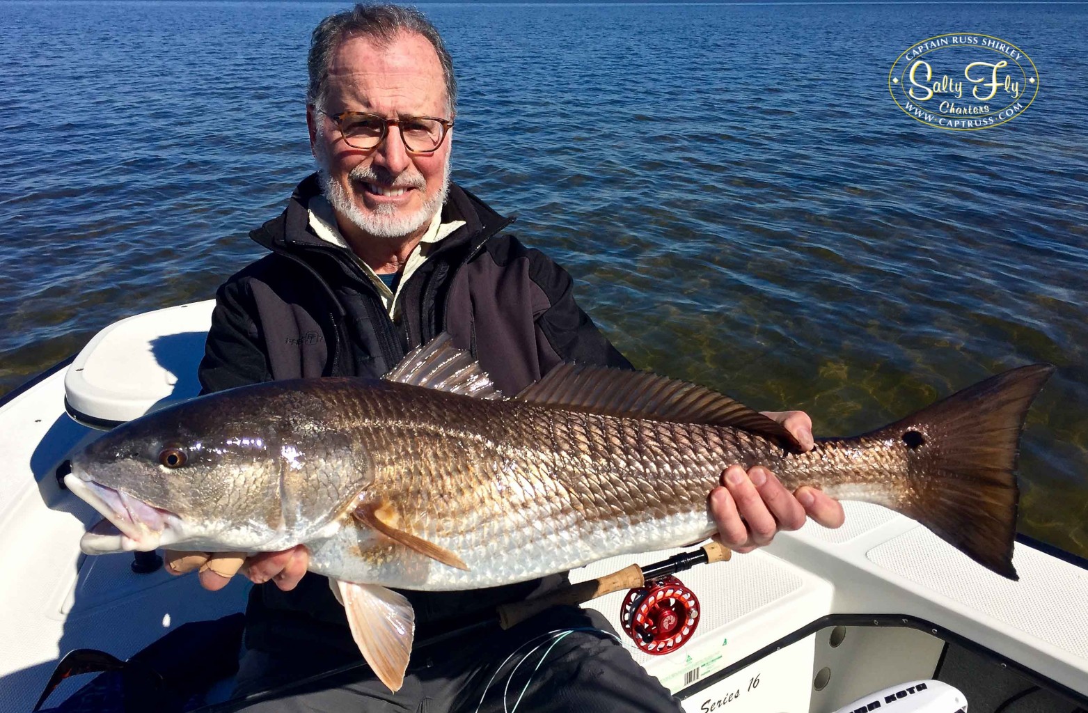 Paul Pezza with his largest Redfish on fly fishing Tampa Bay with Captain Russ Shirley of Salty Fly Charters.